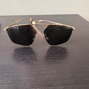 Gucci Gold Frame Sunglasses with Black Accents